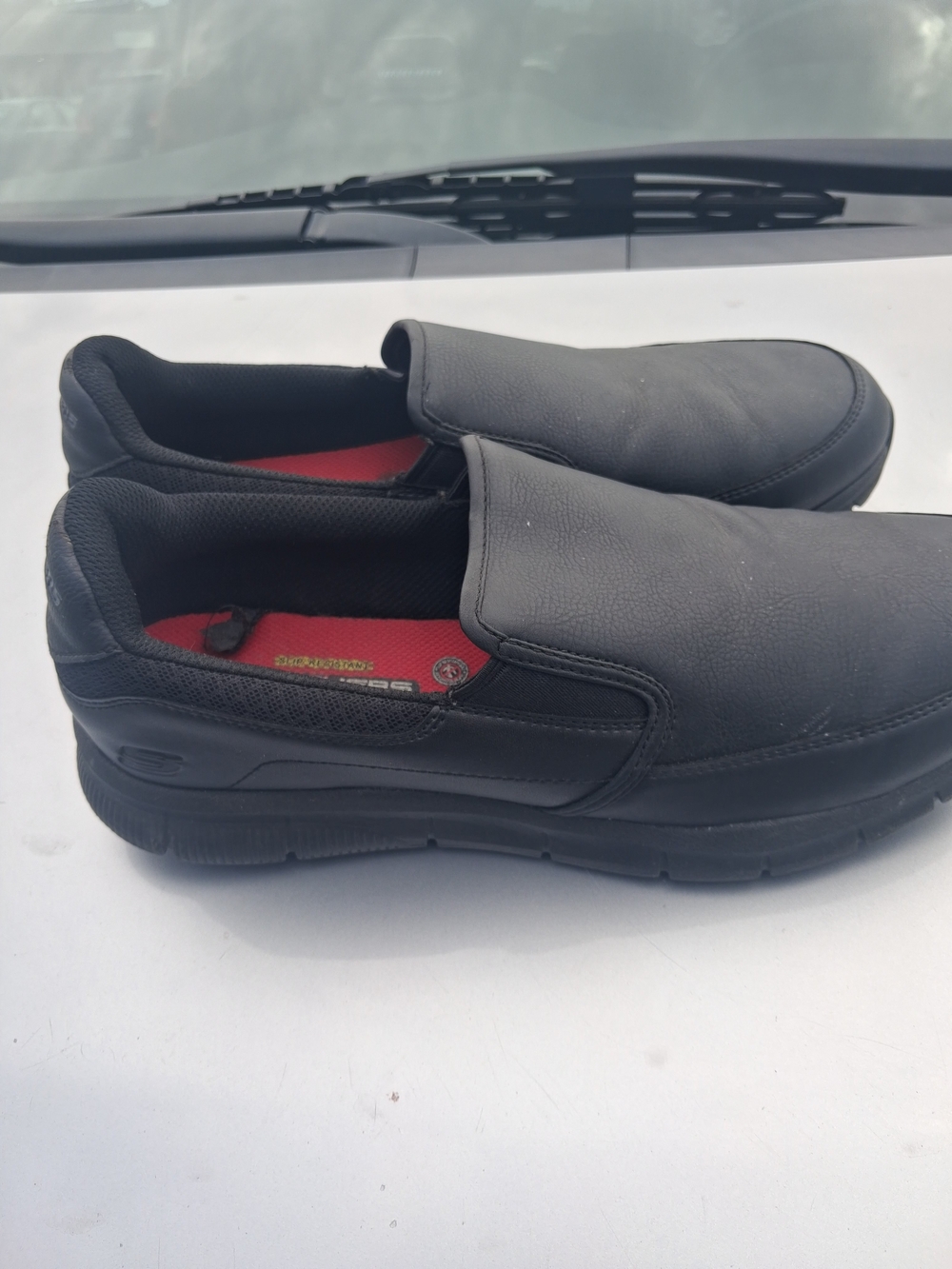 Skechers Black Slip-On Work Loafers with Red Insole